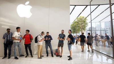 Apple fans join a line to get the new iPhone XS at the Apple store in Dubai Mall. Leslie Pableo / The National