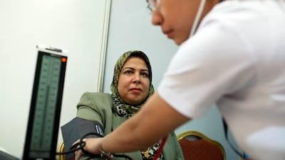 Bian Skran has her blood pressure checked as Red Crescent launched a campaign in Al Marfa in the Western Region to run free clinics for people to be tested for diabetes and breast cancer along with other medical conditions.