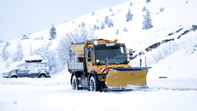 A snow plough in the Cairngorms National Park near Aviemore, Scotland, on Saturday. PA