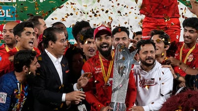 Islamabad United' players and officials celebrate with trophy after winning the final of Pakistan Super League T20 cricket match against Multan Sultans, in Karachi, Pakistan, Monday March 18, 2024. (AP Photo / Fareed Khan)