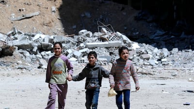Children walk in Douma, Eastern Ghouta, the countryside of Damascus, Syria, 16 April 2018. The seven-year long conflict in Syria has caused 2.8 million children to miss out on their education, according to UNICEF. EPA/STR