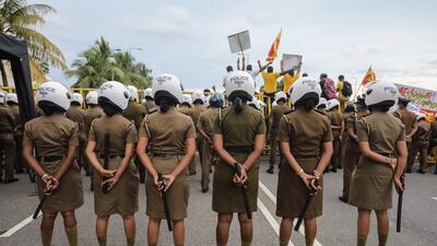 Sri Lankan police behind a police barricade during a protest outside the Presidential Secretariat in Colombo. Thousands of demonstrators stage day and night protests in front of the building calling for the resignation of the president over his alleged failure to address the economic crisis. EPA