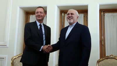 France's top diplomat Emmanuel Bonne shakes hands with Iran's Foreign Minister Mohammad Javad Zarif in Tehran, Iran July 10, 2019. Reuters