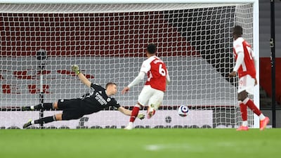Bernd Leno of Arsenal attempts to save a free kick from Harry Kane of Tottenham Hotspur that hits the post. Getty