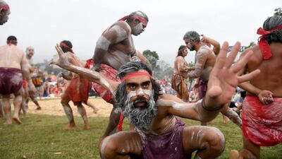Koomurri people and representatives of aboriginal groups from around Australia perform the Smoking Ceremony and Dance at the Barangaroo Reserve in Sydney, as part of Australia Day celebrations. Brendan Esposito / EPA