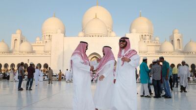 Men from Saudi Arabia greet each other after Eid prayers at Sheikh Zayed Grand Mosque in Abu Dhabi. July 17, 2015. Christopher Pike / The National