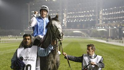 Jockey Maxime Guyon, riding Solow of Britain, celebrates after winning the Dubai Turf during the Dubai World Cup at the Meydan Racecourse in Dubai March 28, 2015. REUTERS/Martin Dokoupil
