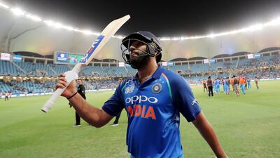 India's Rohit Sharma comes off the field after completing his unbeaten 111.