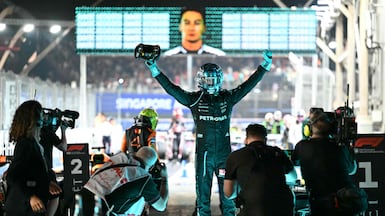 Mercedes driver George Russell celebrates his victory in the Singapore Grand Prix at the Marina Bay Street Circuit. AFP