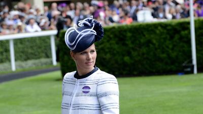 Zara Tindall, wearing a white bolero over a black dress, attends Royal Ascot on June 19, 2015. Getty Images
