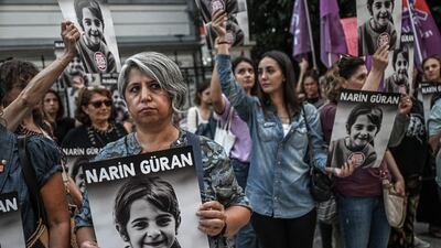 Protesters hold portraits of Narin Guran, 8, whose body was found after being missing for 19 days, during a protest at Kadikoy district in Istanbul, on September 8. AFP
