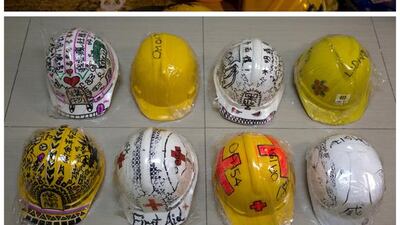 Top, helmets prepared by Occupy Central protesters outside the government headquarters in Hong Kong on October 20, 2014. Bottom, helmets collected from the protest sites on September 23, 2015. Reuters