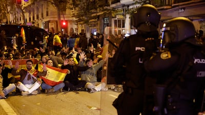 Protesters confront police officers. EPA