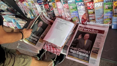 A man looks at the newspapers with news about Spain's former king Juan Carlos I, in Madrid, Spain August 4, 2020. REUTERS