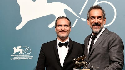 Director Todd Phillips poses next to Joaquin Phoenix with the Golden Lion for Best Film for 'Joker' at the The 76th Venice Film Festival. Reuters