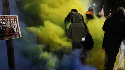 People gather in a protest in front of the embassy of the Russian Federation in Warsaw, Poland. EPA