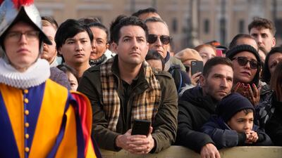 The crowd listens to the Pope. AP