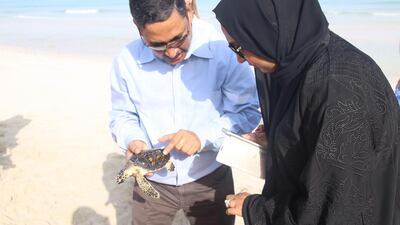 Officials from the Environment Agency Abu Dhabi and Tourism Development Investment Company at Saturday’s release. Wam