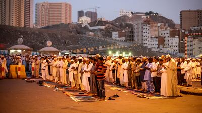 Muslim worshippers pray on the road outside the Grand Mosque in Mecca ahead of Hajj. Mast Irham / EPA