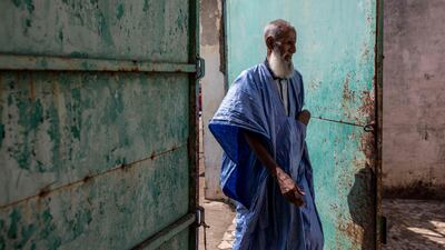 A man enters a mosque before prayers in Banjul, Gambia. AFP