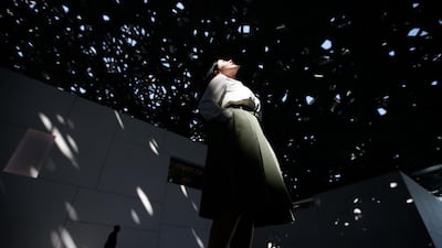 epa07953447 Visitors gather under the building's main dome during a preview of the exhibition '10,000 years of Luxury' at the Louvre Gallery in Abu Dhabi, United Arab Emirates, 27 October 2019. The exhibition also includes a 8,000-year-old pearl of just a few millimeters in diameter that has been discovered during archeological excavations on the Marawah Island near Abu Dhabi. Some 350 extraordinary pieces from around 30 countries spanning several millennia are shown at the exhibition that reportedly opens on 30 October. EPA/ALI HAIDER