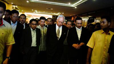 prime minister of Malaysia, Najib Razak leaves after speaking at the press conference to announce that fresh analysis of available satellite data has concluded that missing flight MH370’s final position was in the southern Indian Ocean. Rahman Roslan / Getty Images