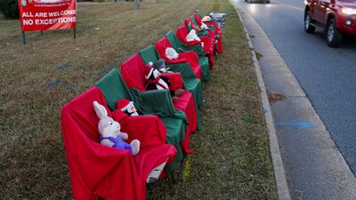 Chairs with stuffed animals sit outside St Thomas Episcopal Church representing the victims of the mass shooting. Reuters