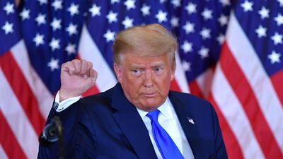 US President Donald Trump pumps his fist after speaking during election night in the East Room of the White House in Washington, DC, early on November 4, 2020. AFP