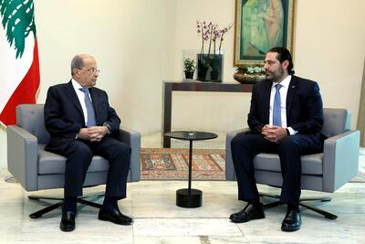 Lebanese President Michel Aoun, left, meets with Prime Minister Saad Hariri ahead of a cabinet meeting at the presidential palace on October 21, 2019. Dalati Nohra via AP