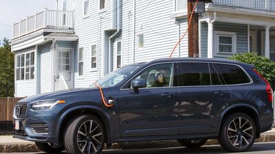 A hybrid car charges at an electric vehicle charging station in the US state of Massachusetts. EPA