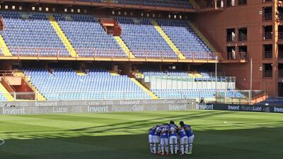 Sampdoria players get together in an empty Luigi Ferraris stadium prior to their Serie A match against Verona. AP