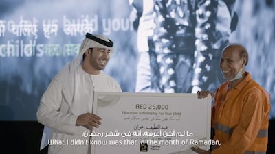 Fifteen construction workers were surprised by Etisalat with a Dh25,000 scholarship towards their children's higher education. Courtesy, Etisalat