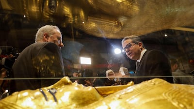 Egypt's Antiquities Minister Khaled El-Enany and US Charge d'Affaires in Cairo Thomas Goldberger talk to media near the coffin. Reuters