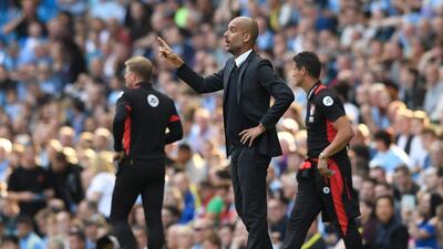 Manchester City manager Pep Guardiola gives his team instructions against Bournemouth. Stu Forster / Getty Images