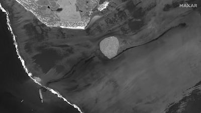 A satellite image from Maxar Technologies shows the bulk carrier spilling oil into the sea off Mauritius.