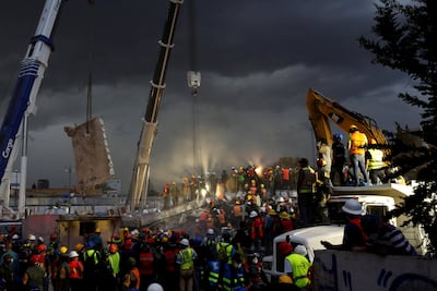 Rescue workers and Mexican soldiers take part in a rescue operation at a collapsed building after an earthquake at the Obrera neighborhood in Mexico City. Carlos Jasso / Reuters