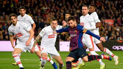 Barcelona forward Lionel Messi scores against Eibar in Barcelona's 3-0 win at Camp Nou. It was the Argentine's 400th La Liga goal for the club. Reuters