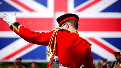 A conductor leads an orchestra during day five of Royal Ascot at Ascot racecourse, England. PA