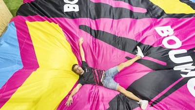 Bounce Middle East CEO Doran Davies lands on a cushion after jumping off a platform. Antonie Robertson / The National