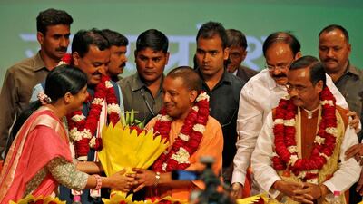 India's ruling Bharatiya Janata Party (BJP) leader Yogi Adityanath, centre, greeted after he was elected as chief minister of India's most populous state of Uttar Pradesh, during the party lawmakers' meeting in Lucknow, India March 18, 2017. Pawan Kumar/Reuters
