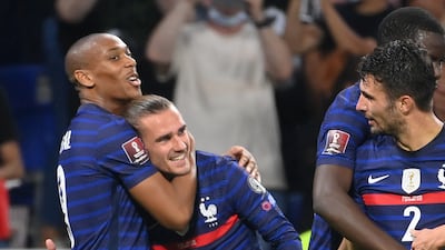 France forward Antoine Griezmann is congratulated by Anthony Martial after scoring his team's second goal against Finland. AFP