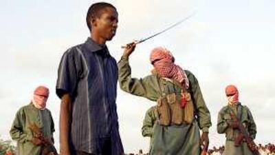 A Somali teenager is whipped in public after being convicted of rape in Mogadishu in March.