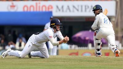 England's Ollie Pope takes the catch to dismiss India's Rajat Patidar, off the bowling of Shoaib Bashir. Reuters