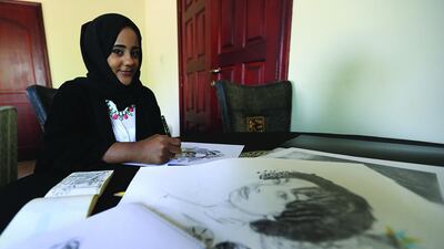 Fatima Farah pictured with some of her artwork at her home in Abu Dhabi. Ravindranath K / The National