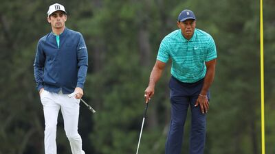 Joaquin Niemann and Tiger Woods on the 18th green during the second round of The Masters at Augusta National Golf Club. AFP