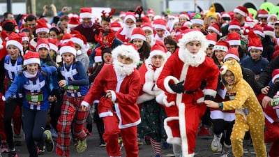 Runners dressed in Santa Claus costumes take part in the 15th edition of the Christmas Run in Lausanne, Switzerland, 18 December 2022. More than 600 runners, dressed up as a Christmas figure participated (in two categories Santa Claus and Family) in the 2. 3 kilometer run through the old part of the city of Lausanne. EPA / LAURENT GILLIERON
