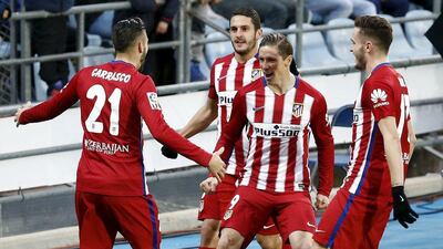 Atletico Madrid players celebrate a goal against Getafe in La Liga last weekend. Andrea Comas / Reuters / February 14, 2016