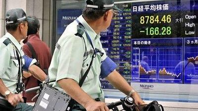 Japan's Nikkei 225 fell 1.9 per cent to close at 8,784.46. Yoshikazu Tsuno / AFP