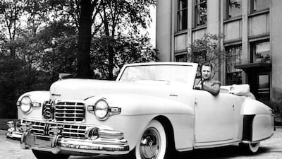 In this June 1946 photo, Henry Ford II, grandson of Ford Motor Co founder Henry Ford, is seated in a Ford Lincoln Continental. Ford Motor Co / AP Photo