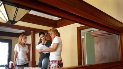 Prospective home buyers discuss their needs with a property agent in Phoenix, Arizona. There has been an increase in demand for houses in the US on account of a rise in US stock prices, which have been boosted by a strengthening economy. Joshua Lott / Bloomberg News